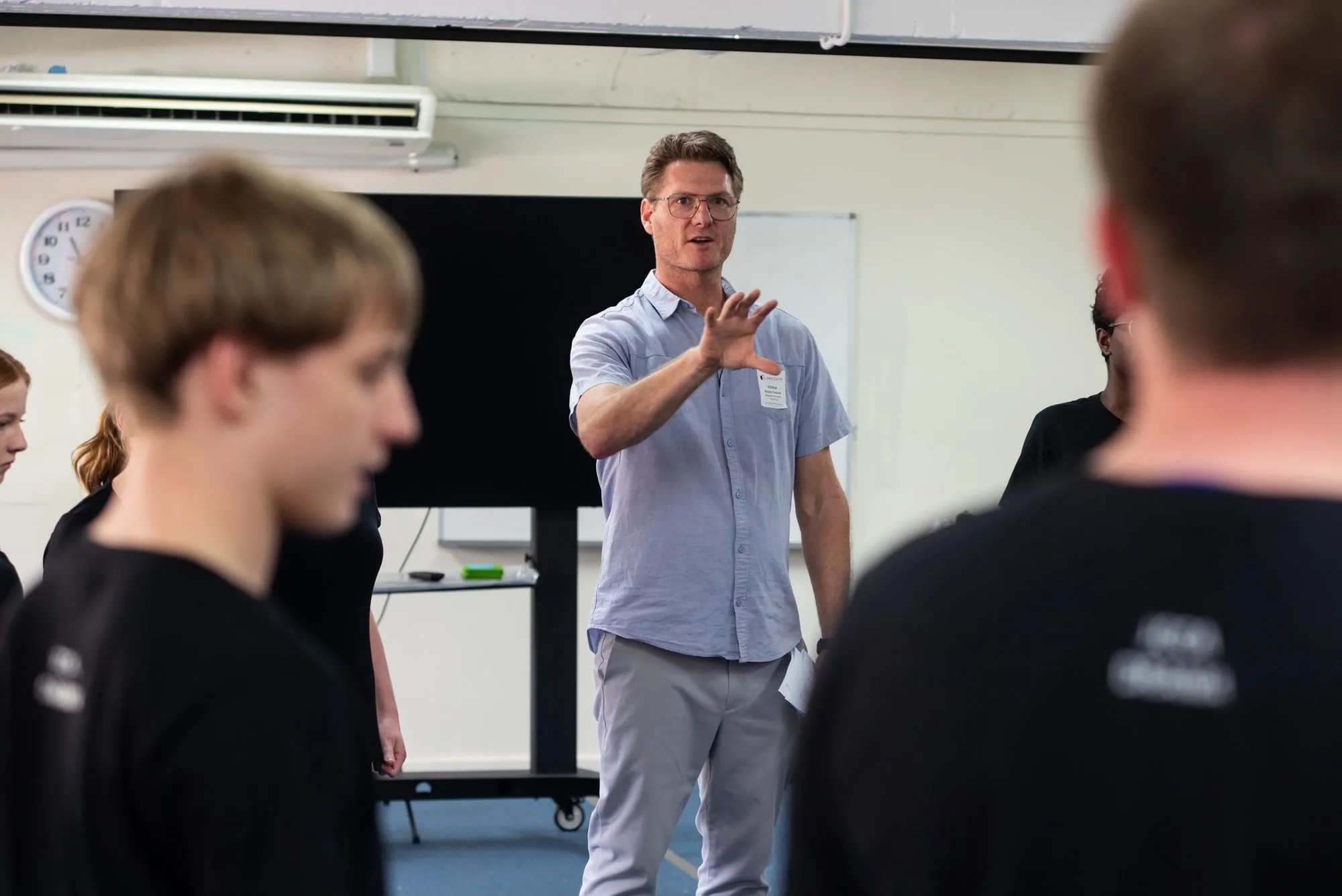 Myles Pollard directing students during an acting workshop